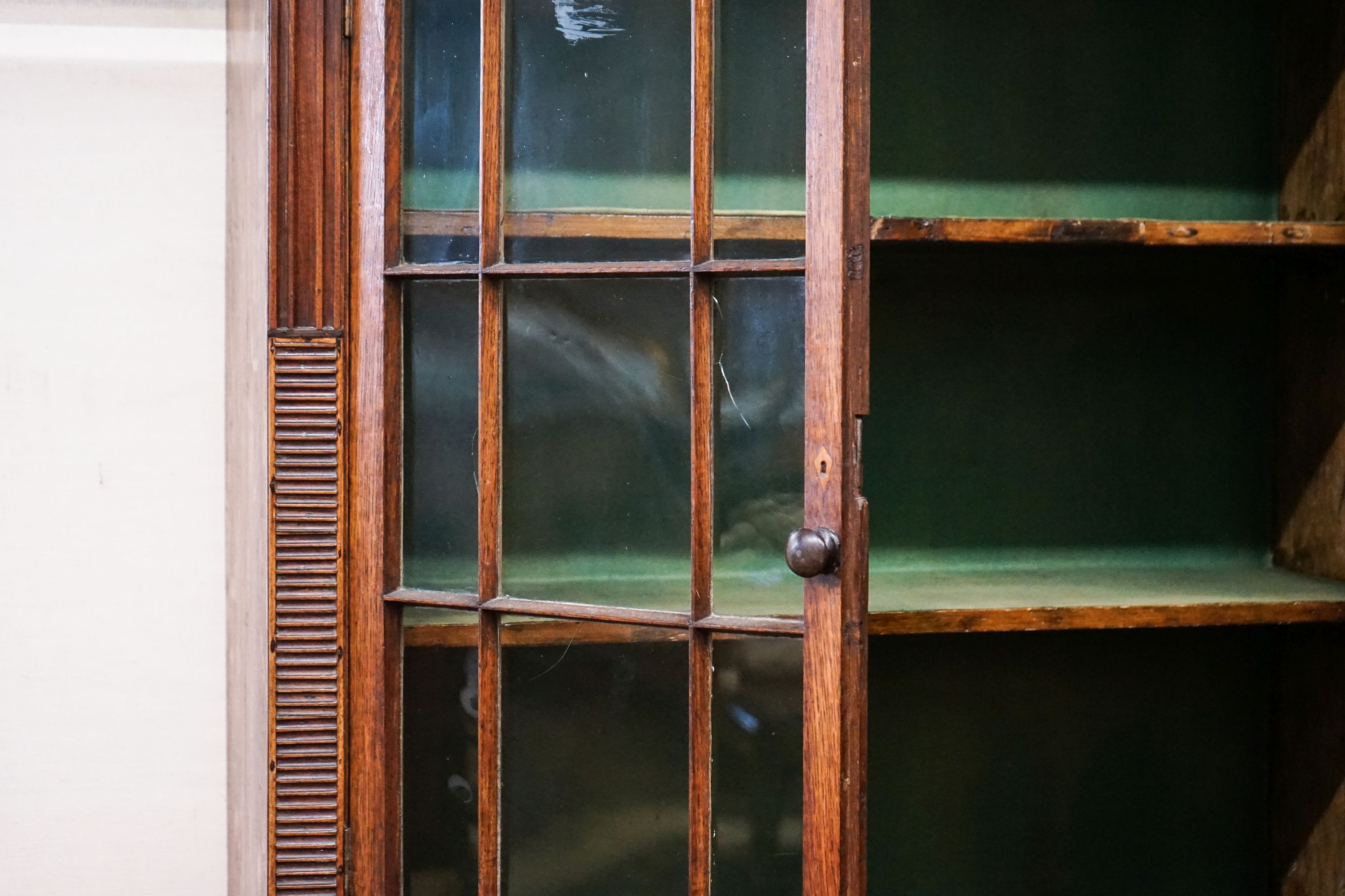 A George IV oak and mahogany bookcase on chest, width 97cm, depth 47cm, height 202cm